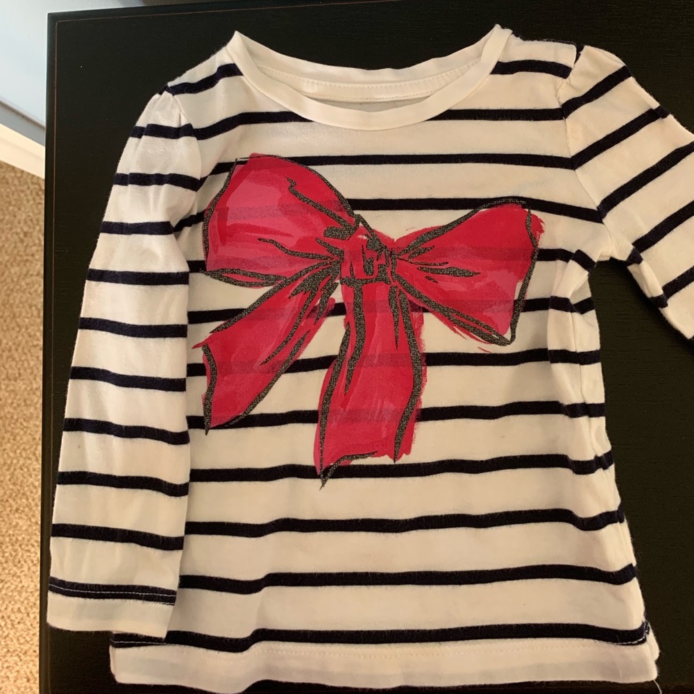 White and navy blue striped shirt with bow
